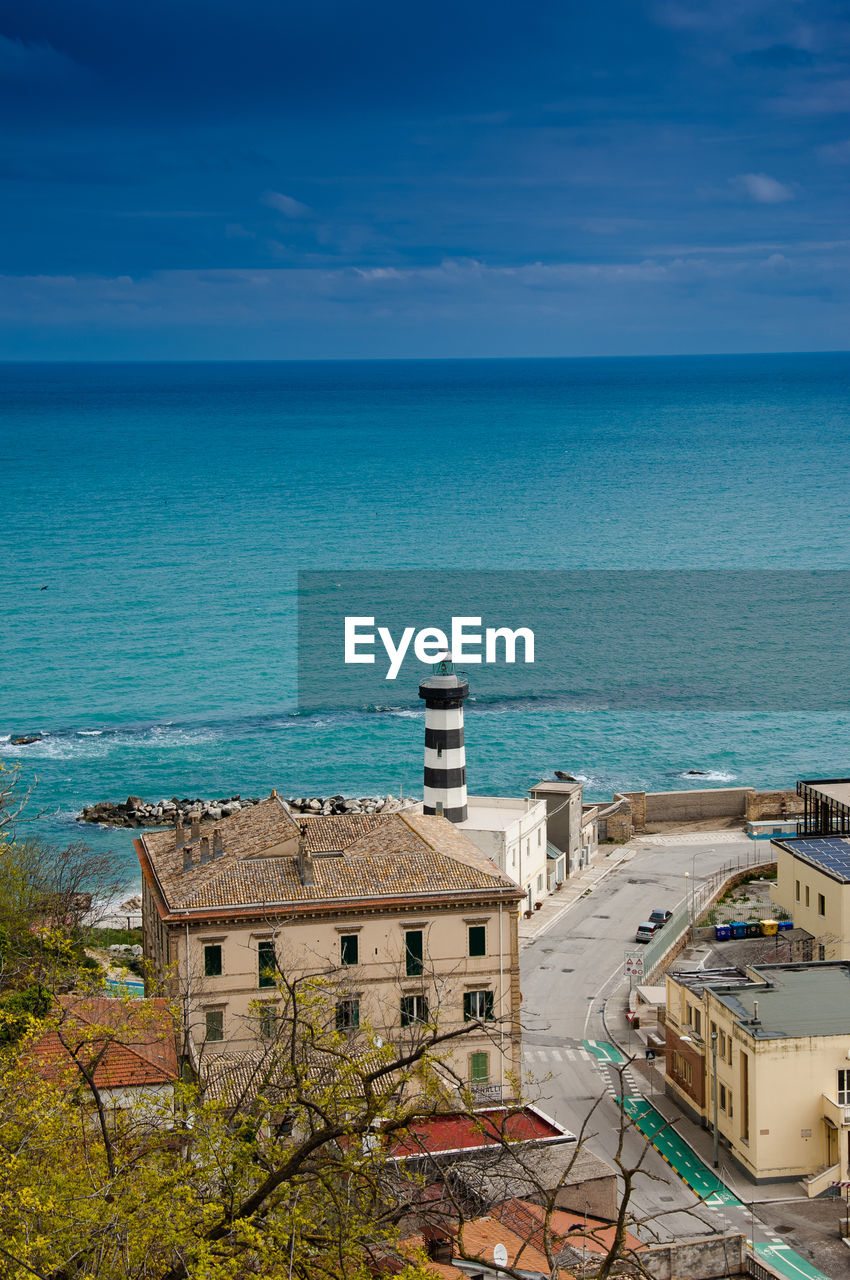 High angle view of buildings against sea