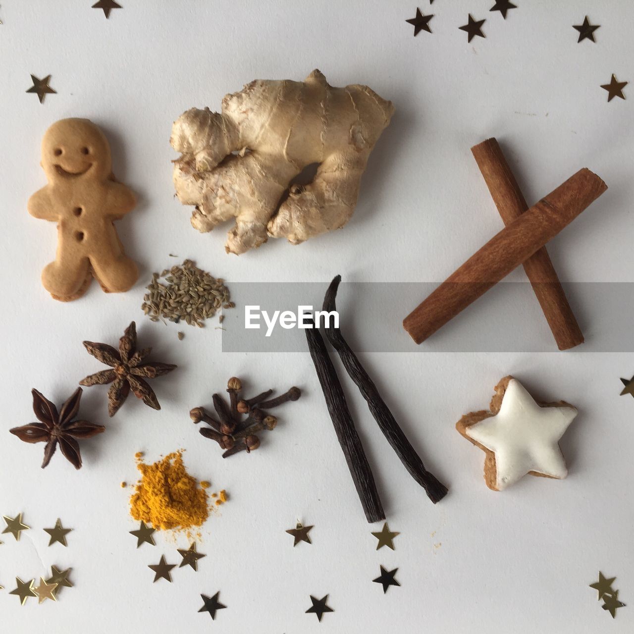 High angle view of cinnamons and star anise on white background