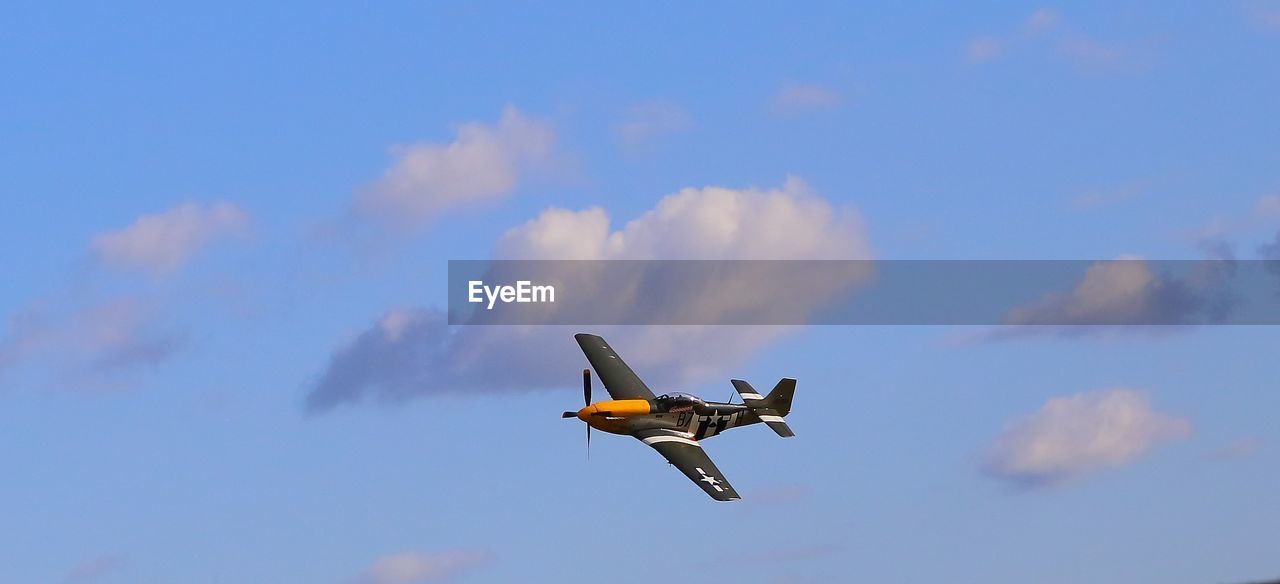 LOW ANGLE VIEW OF AIRPLANE AGAINST SKY