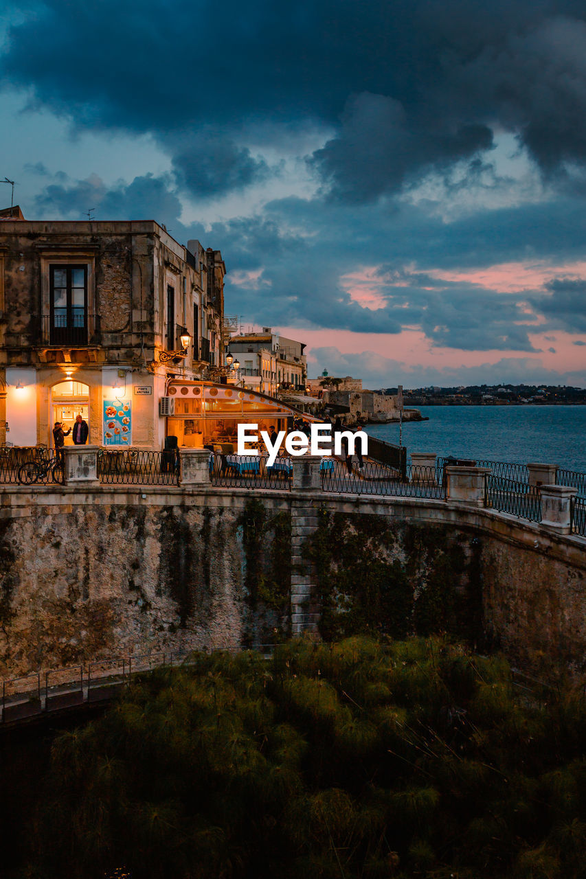 Panoramic view of ortigia with fonte aretusa and lungomare alfeo  during sunset