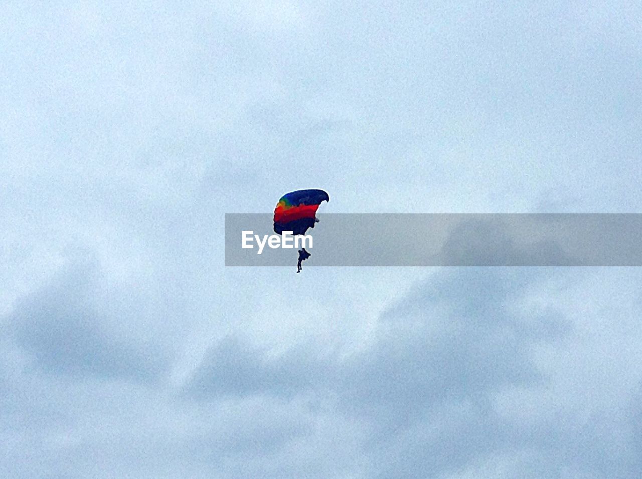 LOW ANGLE VIEW OF PARACHUTE IN SKY