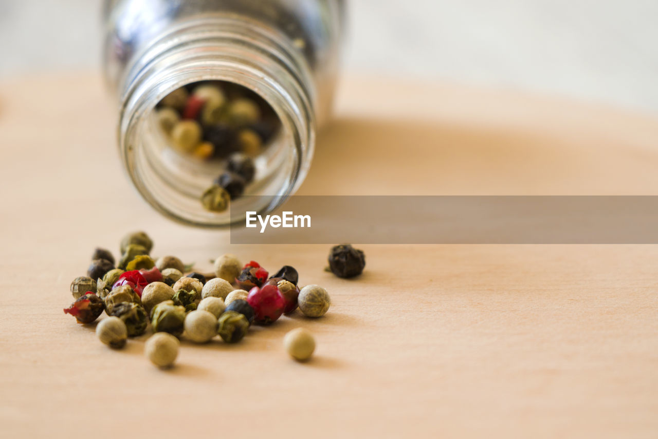 Close-up of species in  jar on table