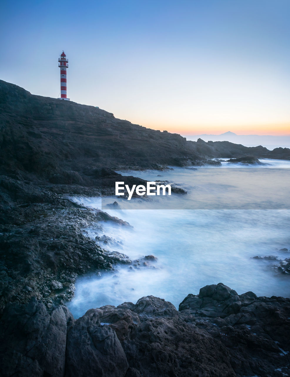 Scenic view of sea and buildings against sky