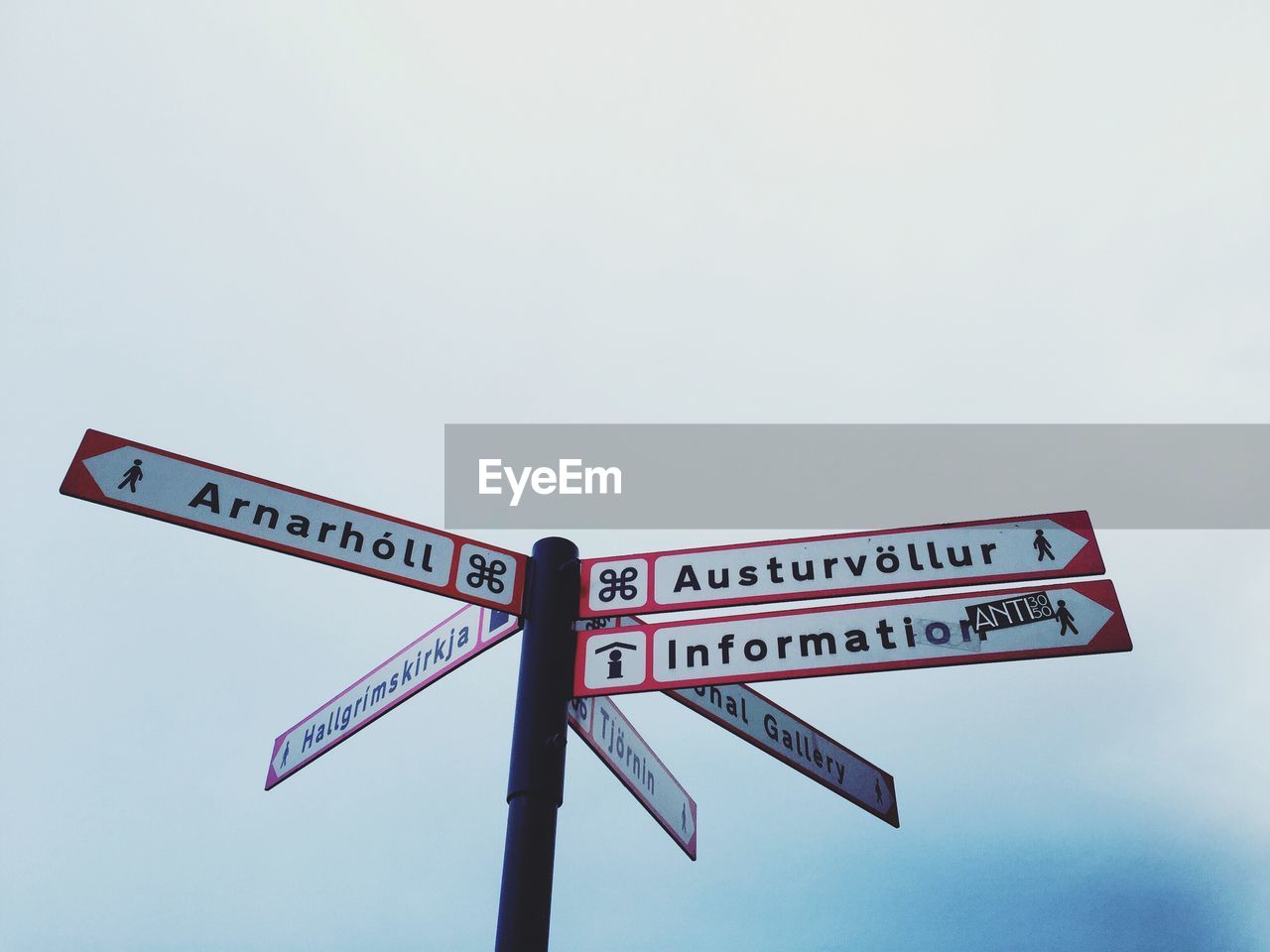 LOW ANGLE VIEW OF ROAD SIGNS AGAINST CLEAR SKY