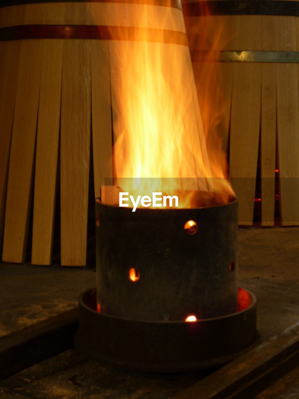 CLOSE-UP OF ILLUMINATED BURNING CANDLES