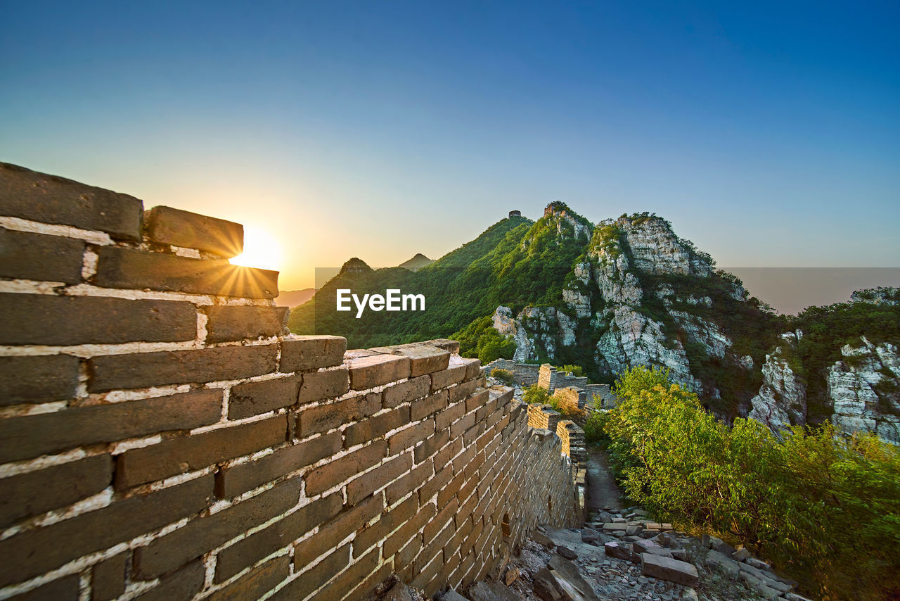 Great wall of china on mountain against clear sky