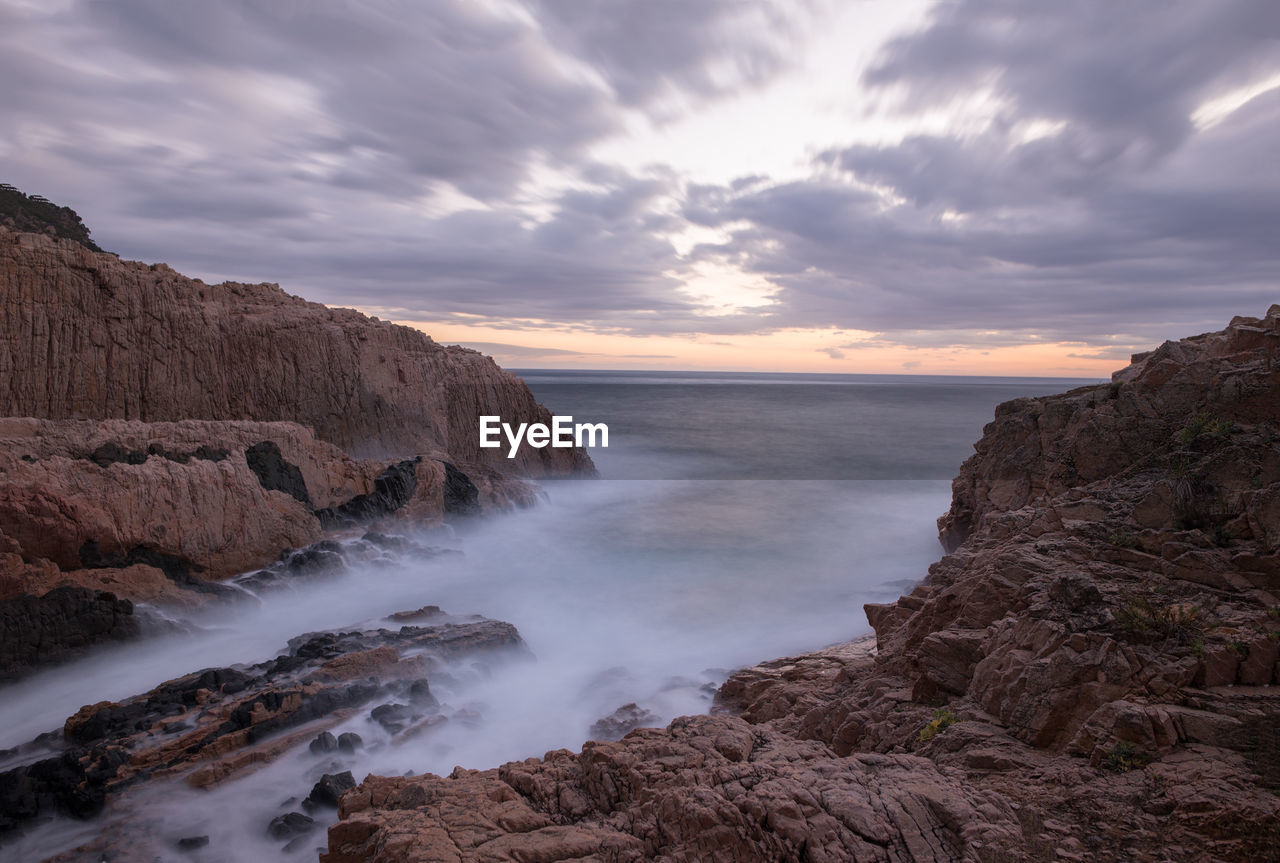 Scenic view of sea against sky at sunset