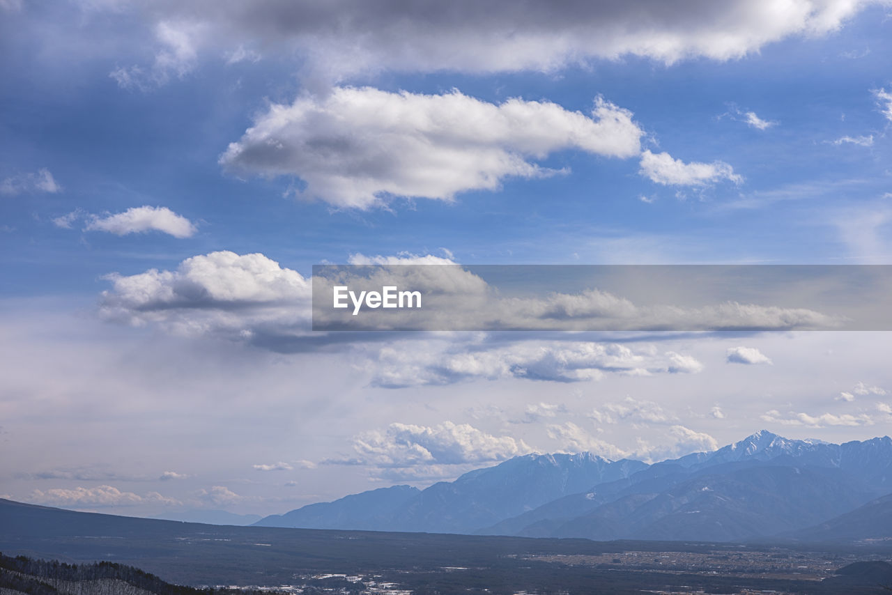 SCENIC VIEW OF CLOUDS OVER MOUNTAIN