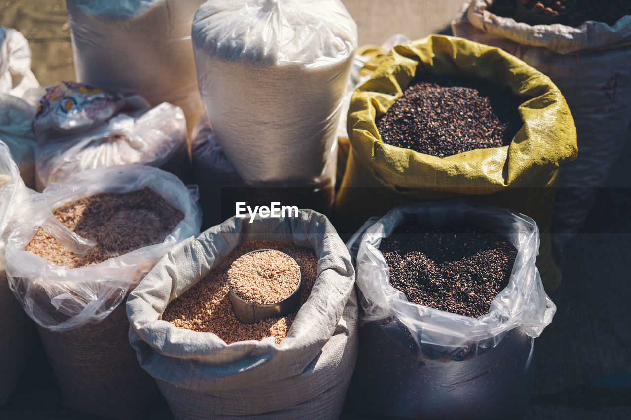 High angle view of various food grain for sale in market