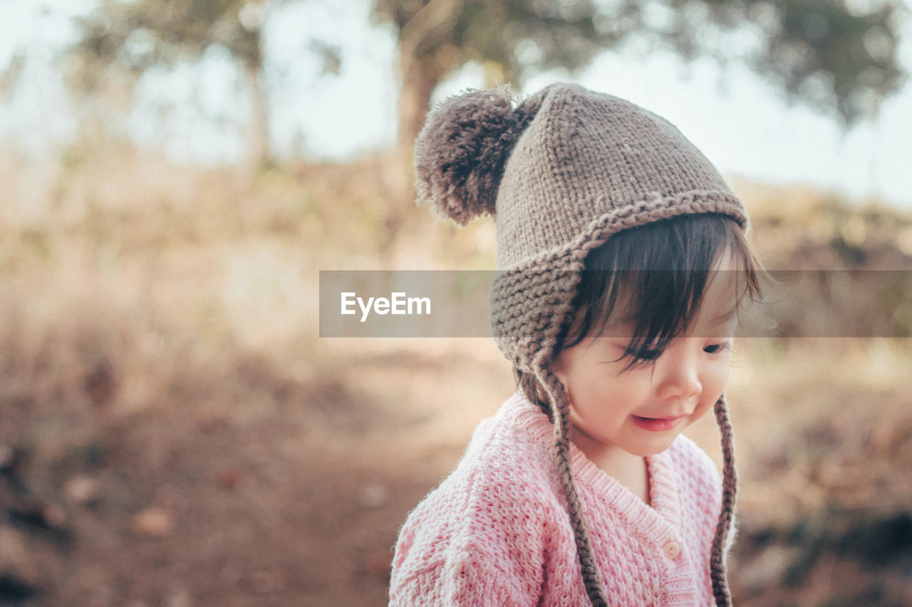 Cute girl smiling standing outdoors during winter