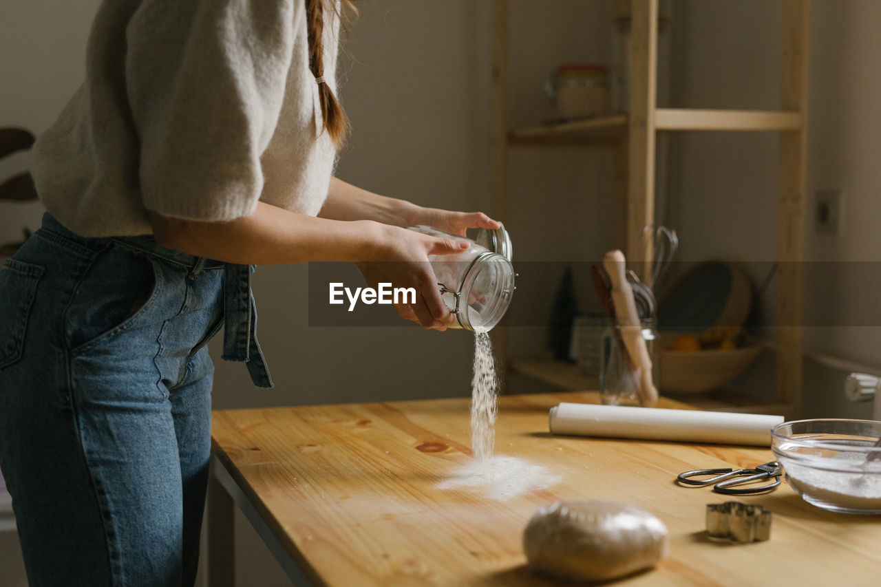 Young woman making christmas cookies