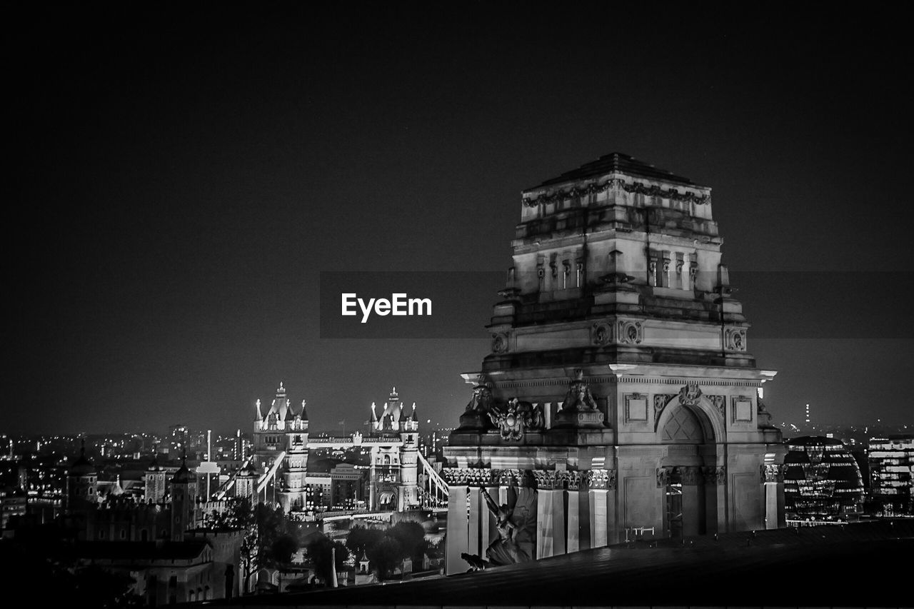 BUILDINGS IN CITY AT NIGHT