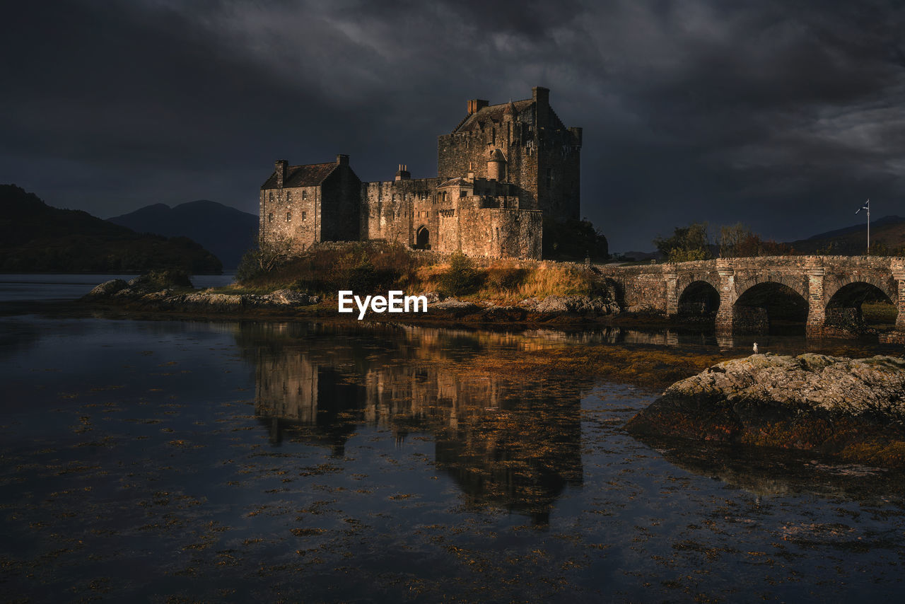 Scottish castle in sunlight on a stormy day