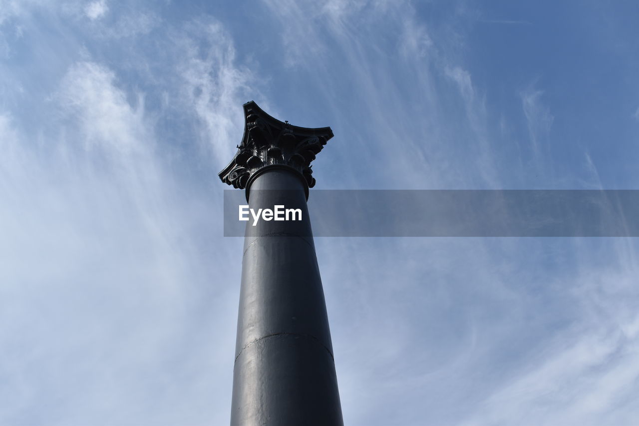 LOW ANGLE VIEW OF STATUES AGAINST SKY