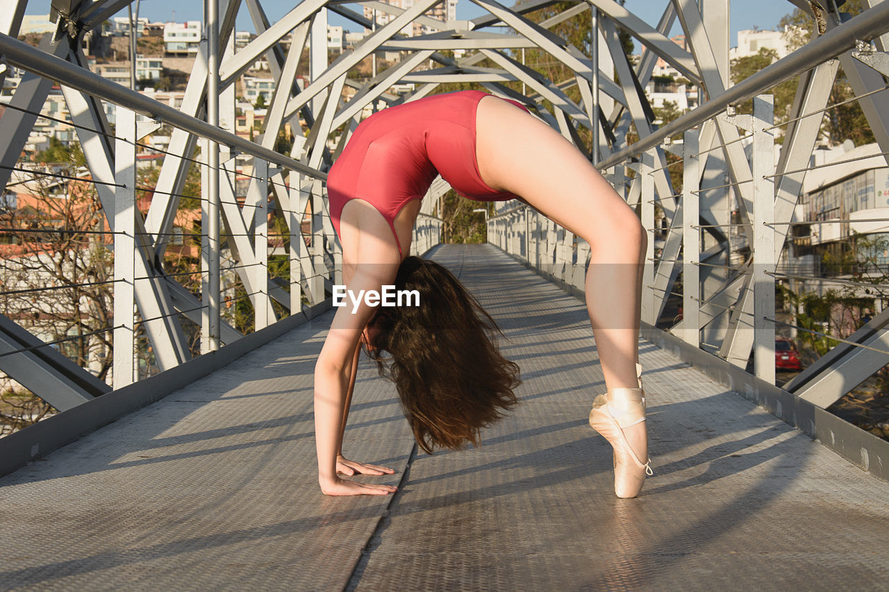 Ballet dancer performing on bridge