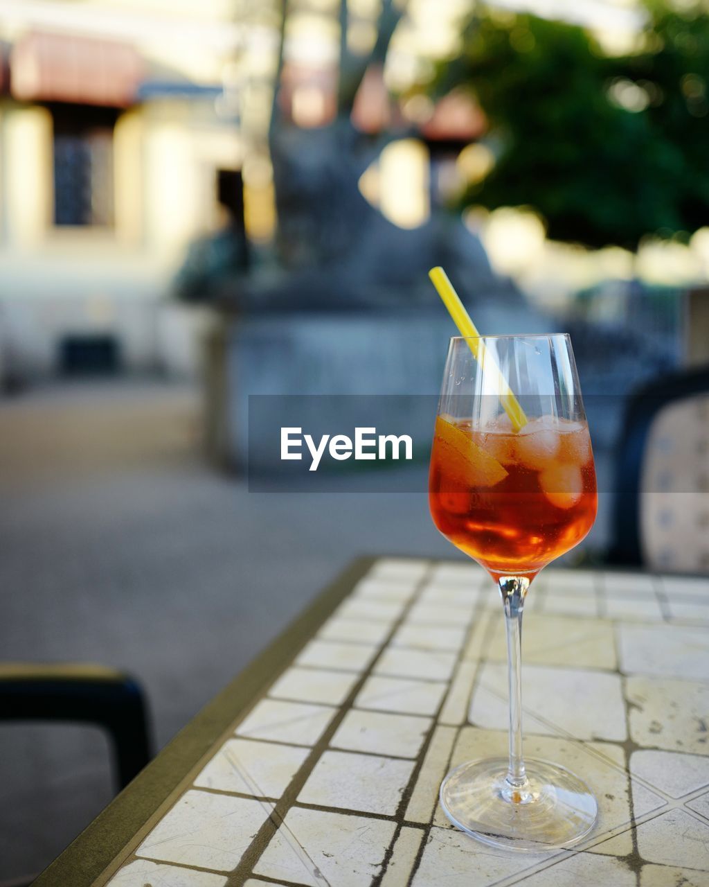 Aperitiv in glass standing on the table in outside cafe in berlin 