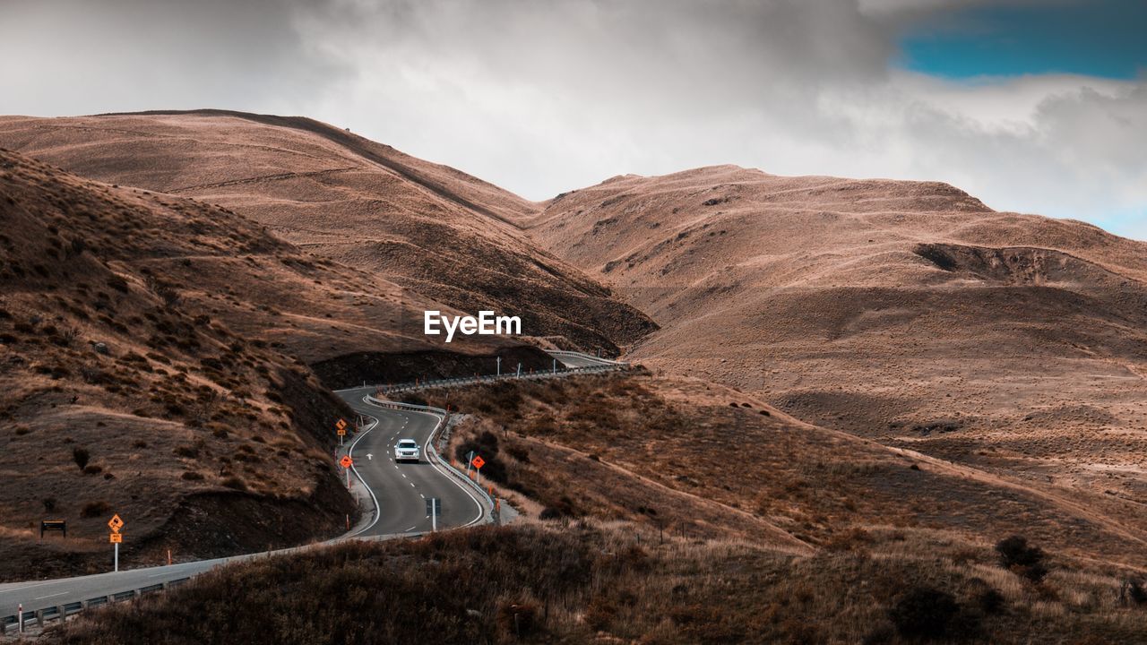 Scenic view of mountain road against sky