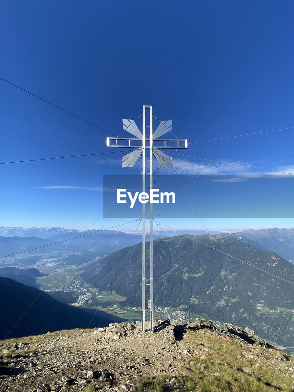 OVERHEAD CABLE CAR ON MOUNTAINS AGAINST SKY