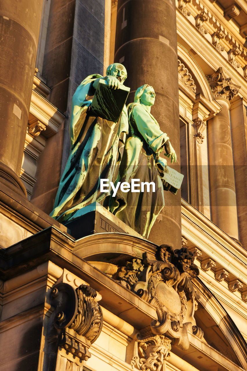 Low angle view of statue on historic building