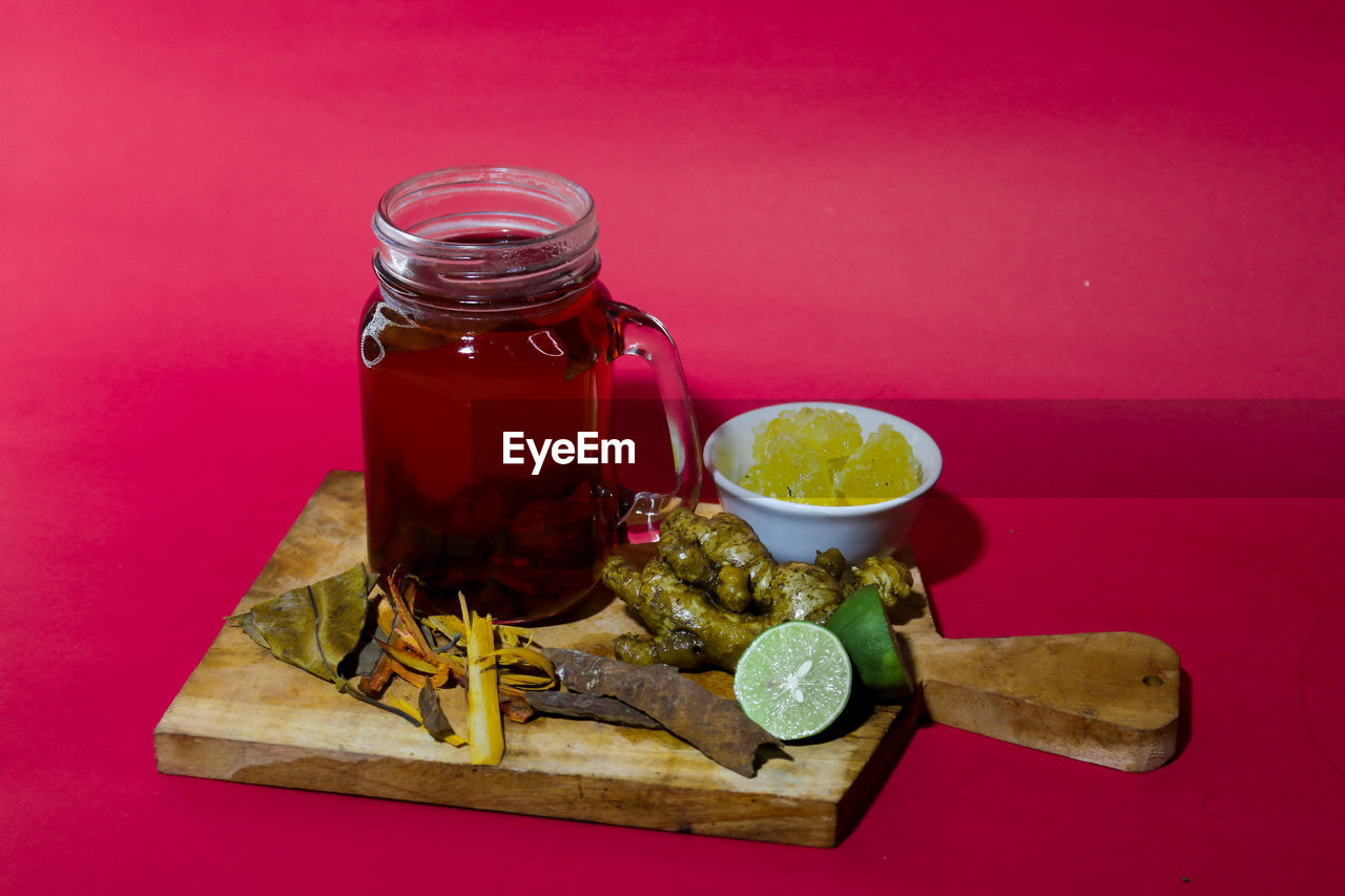 CLOSE-UP OF DRINK IN JAR