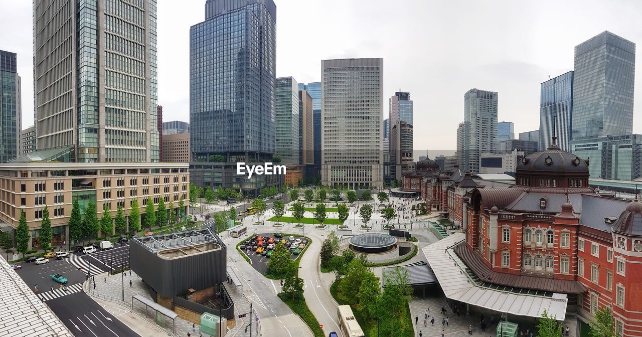 HIGH ANGLE VIEW OF BUILDINGS AGAINST SKY