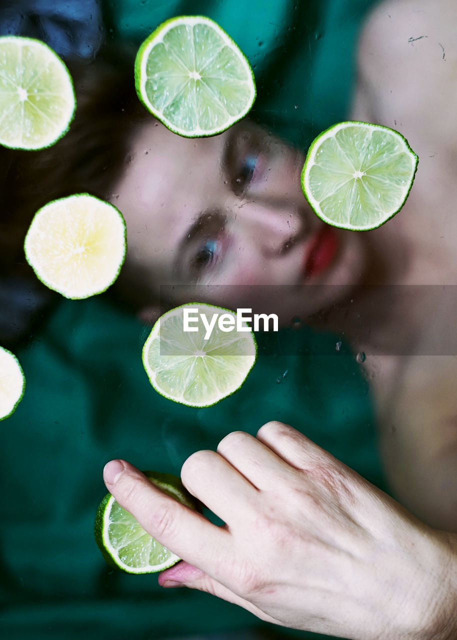 Cropped image of woman holding water