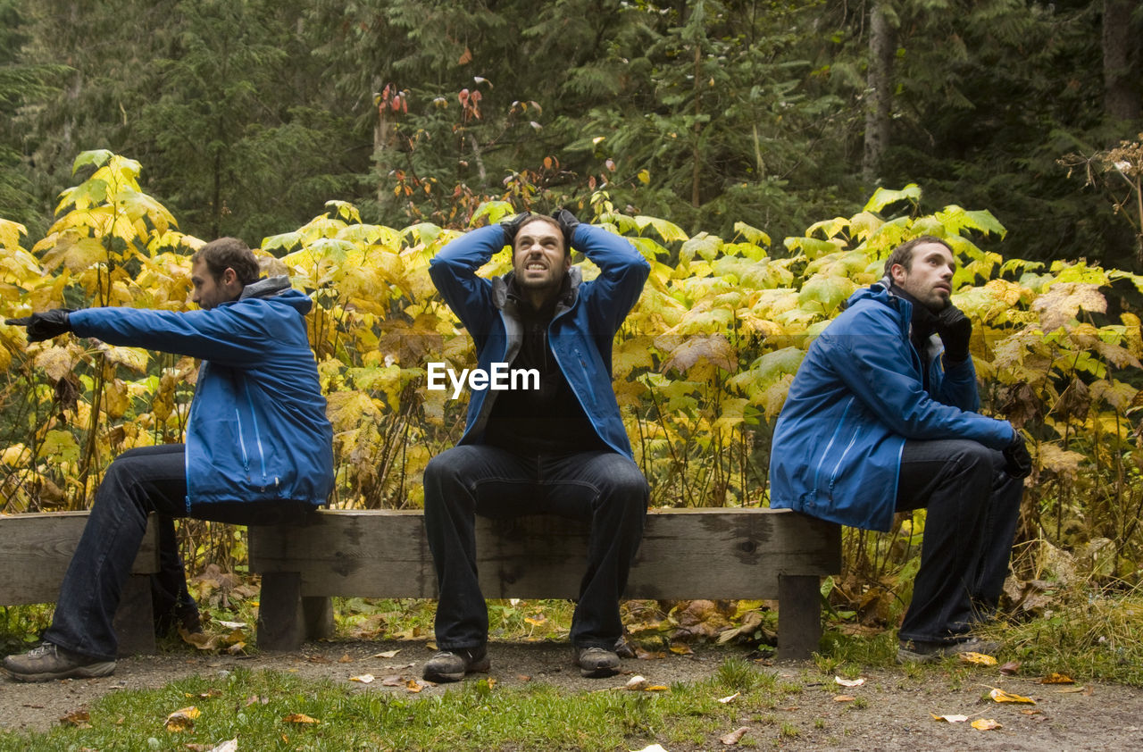 Multiple image of man sitting on wooden bench at banff national park