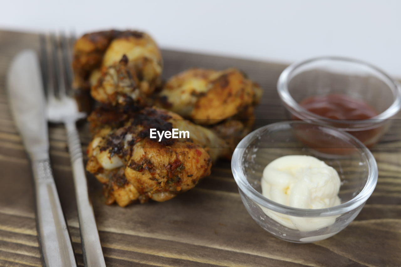 food and drink, food, dish, freshness, breakfast, healthy eating, produce, dessert, meal, indoors, fried food, wellbeing, no people, baked, close-up, studio shot, cuisine, wood, eating utensil, focus on foreground, meat, bowl, table, kitchen utensil, vegetable, household equipment, chicken meat