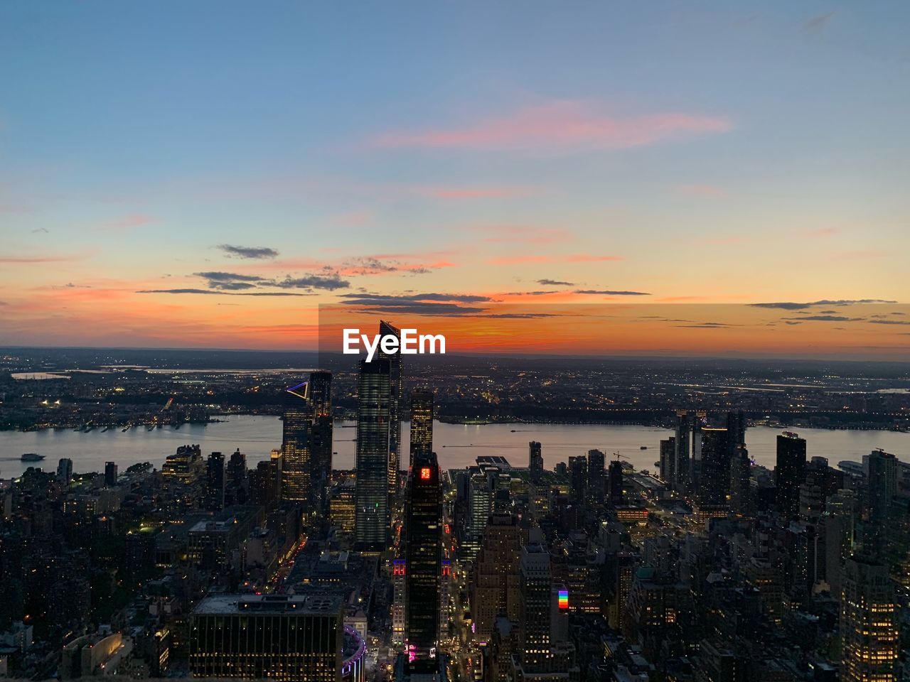 Aerial view of city buildings during sunset