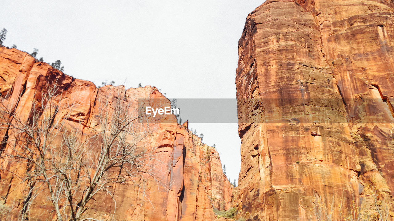 Low angle view of rock formations against sky