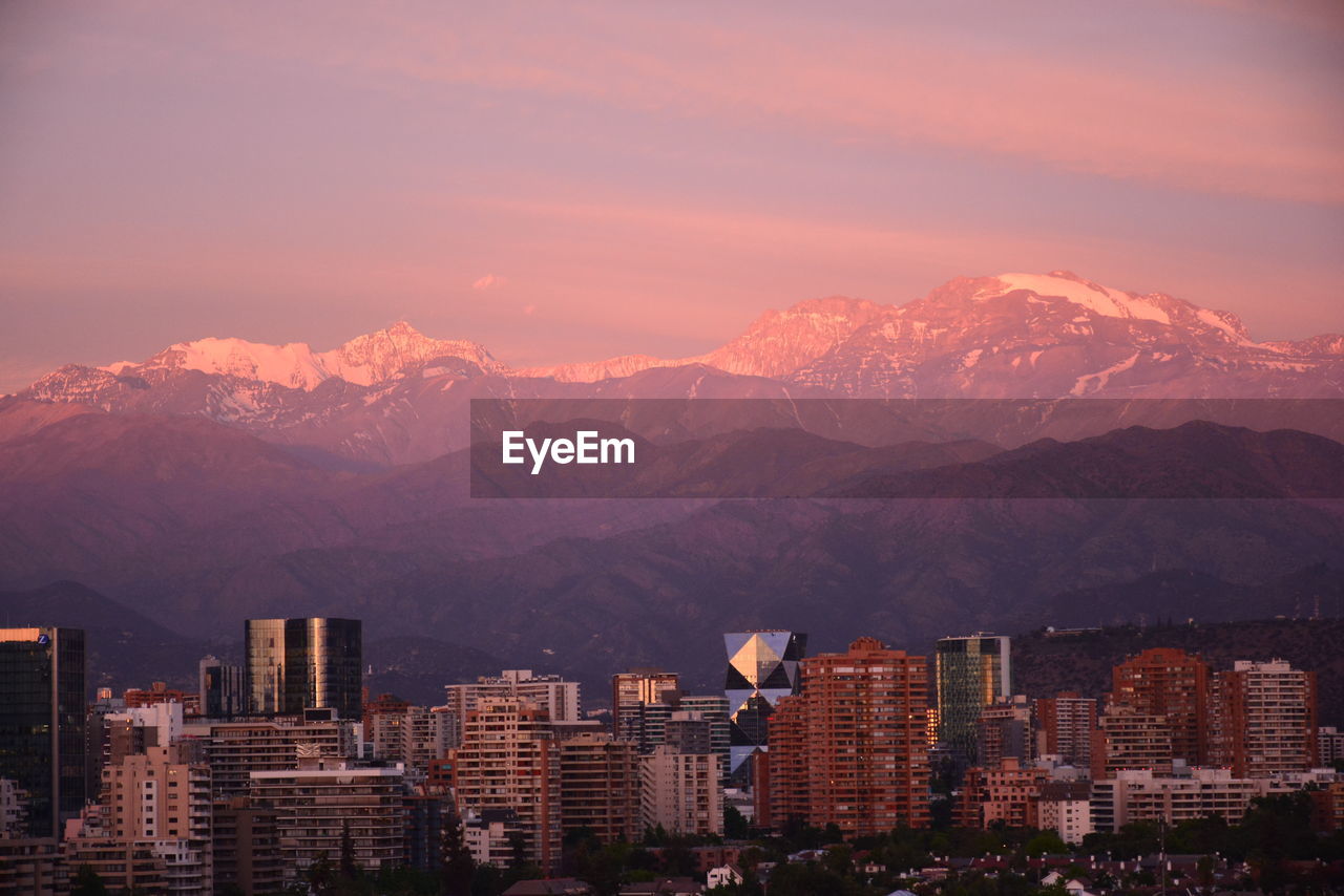 High angle view of buildings against sky during sunset