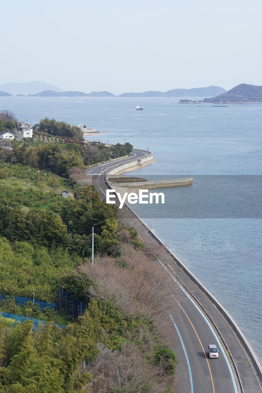 HIGH ANGLE VIEW OF ROAD AGAINST SKY