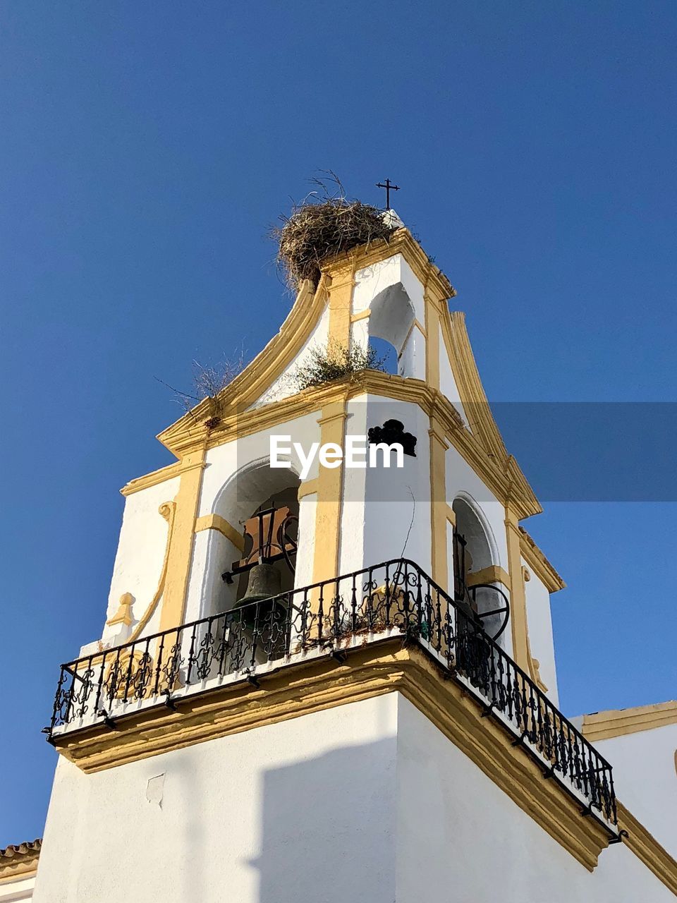 Low angle view of traditional building against clear blue sky