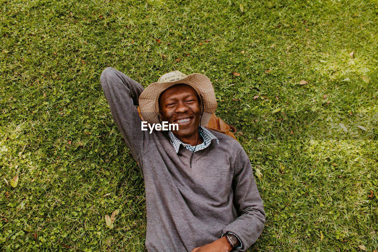 Portrait of smiling young man on field