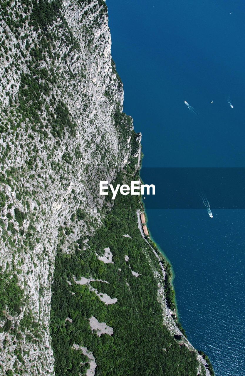 High angle view of rocks by sea