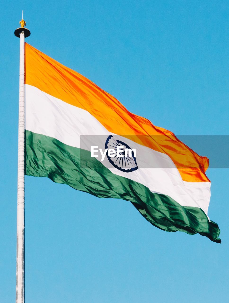 Indian flag against blue sky
