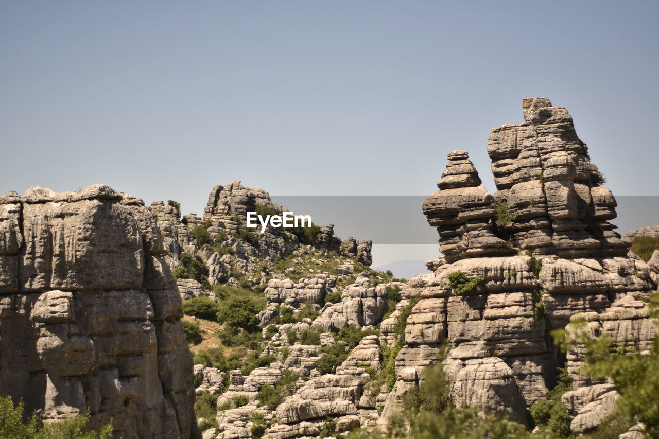 Low angle view of ancient mountain against clear sky