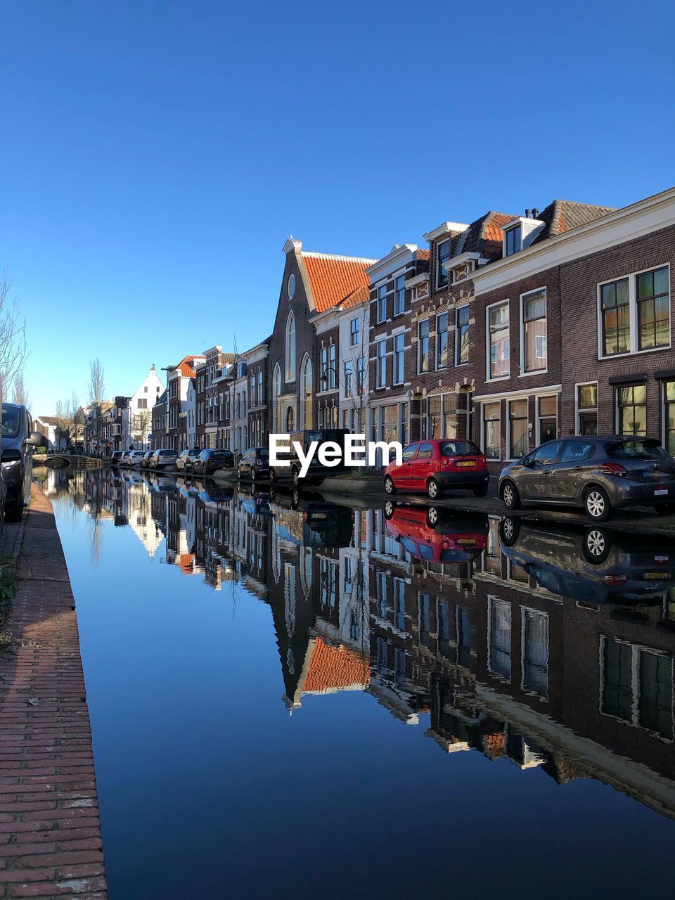 Reflection of buildings in water dutch city 