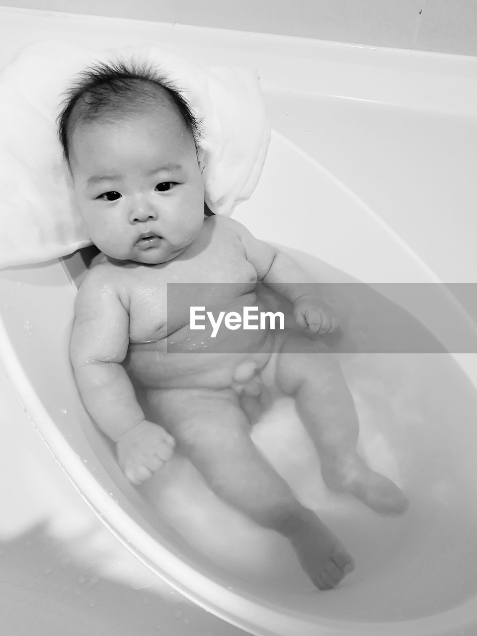 High angle view of cute baby boy in bathtub