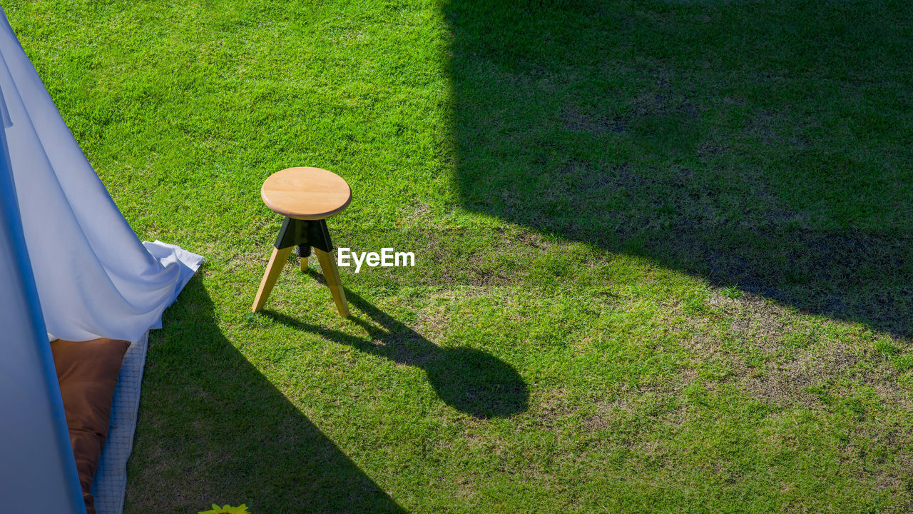 HIGH ANGLE VIEW OF WOMAN ON FIELD