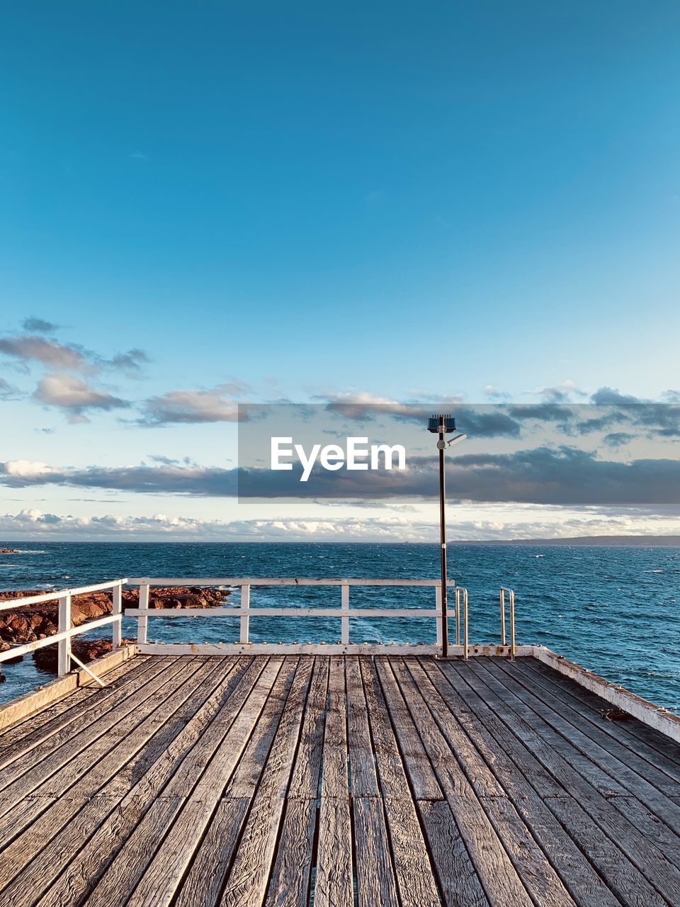 Pier over sea against sky