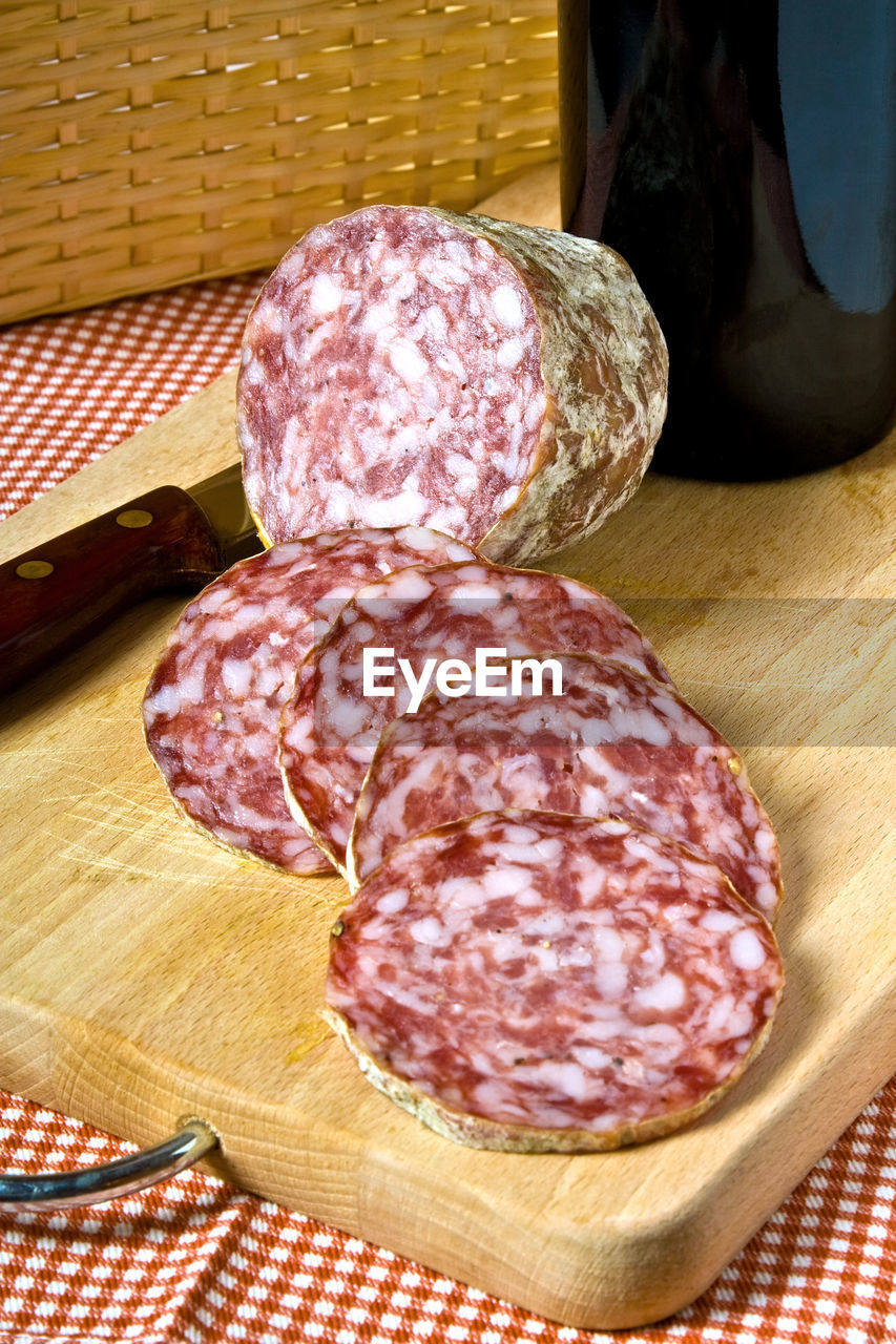 Close-up of salami on table