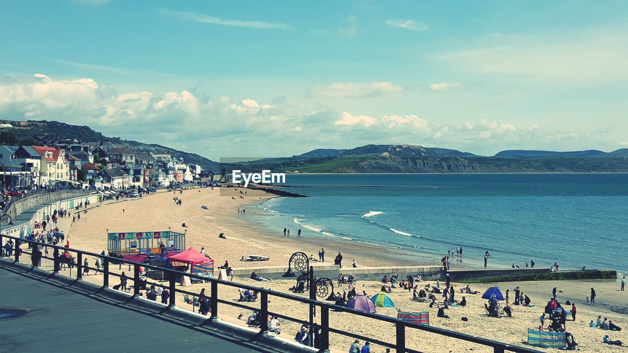 Scenic view of beach by sea against sky