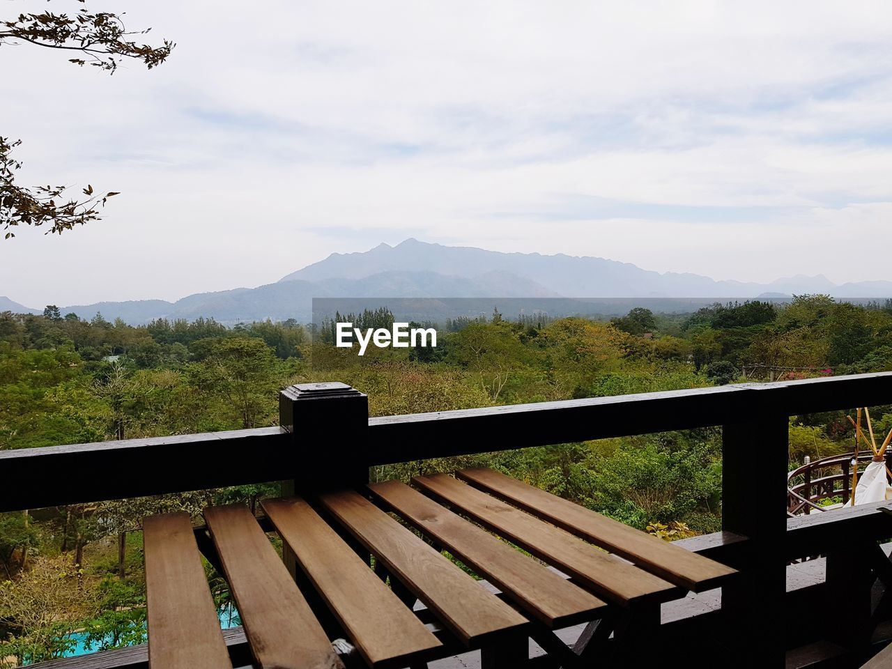 EMPTY RAILING AGAINST MOUNTAINS