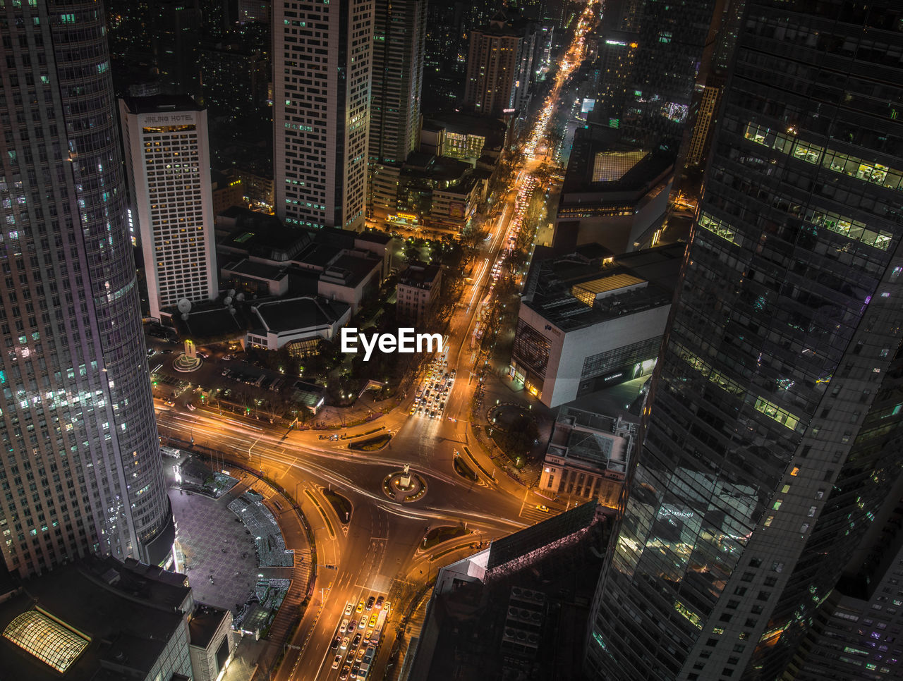 High angle view of illuminated buildings in city at night