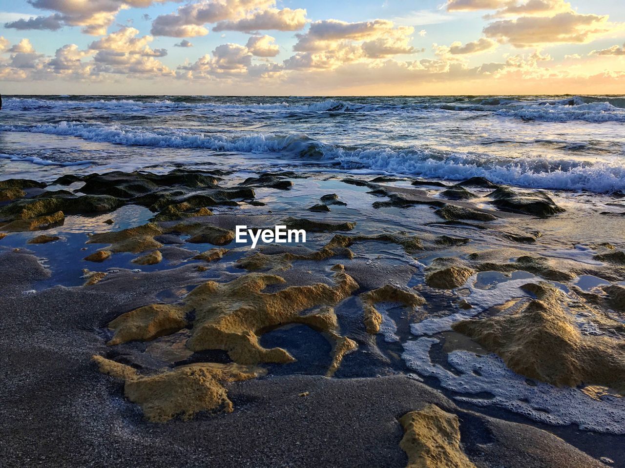 Scenic view of sea against sky at sunset