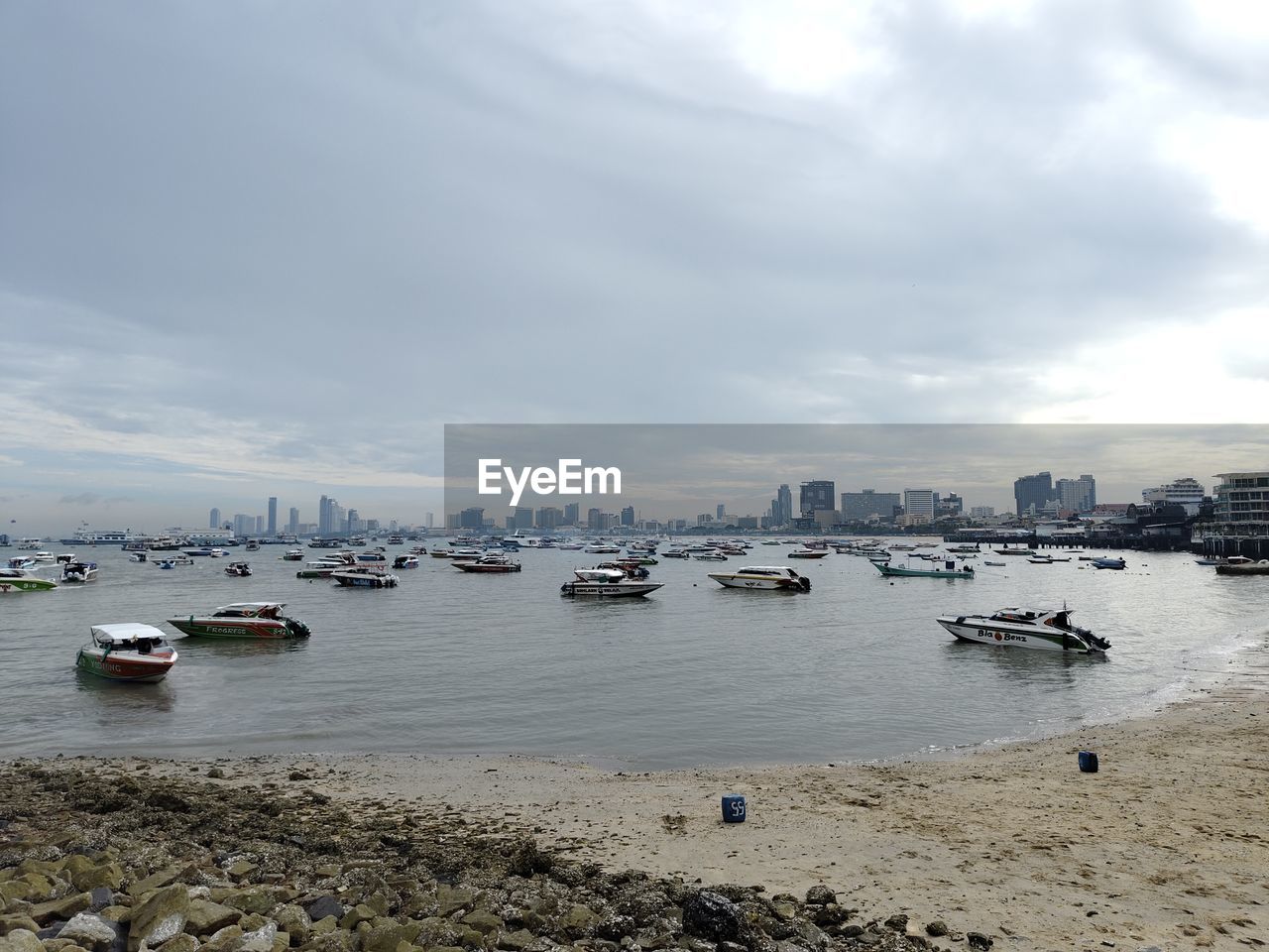 water, nautical vessel, transportation, sky, mode of transportation, cloud, sea, ship, architecture, shore, city, coast, nature, body of water, harbor, beach, travel destinations, travel, land, building exterior, built structure, vehicle, day, no people, moored, cityscape, outdoors, building, tourism, sailboat, bay, boat, beauty in nature, landscape, scenics - nature, watercraft, vacation, holiday, environment, urban skyline, trip, yacht, craft, overcast, tranquility, pier, sailing, ocean