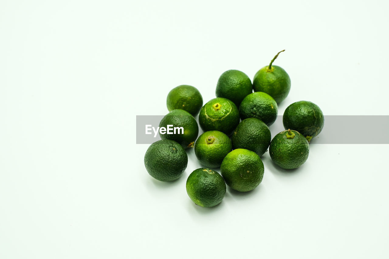 HIGH ANGLE VIEW OF FRUITS IN WHITE BACKGROUND
