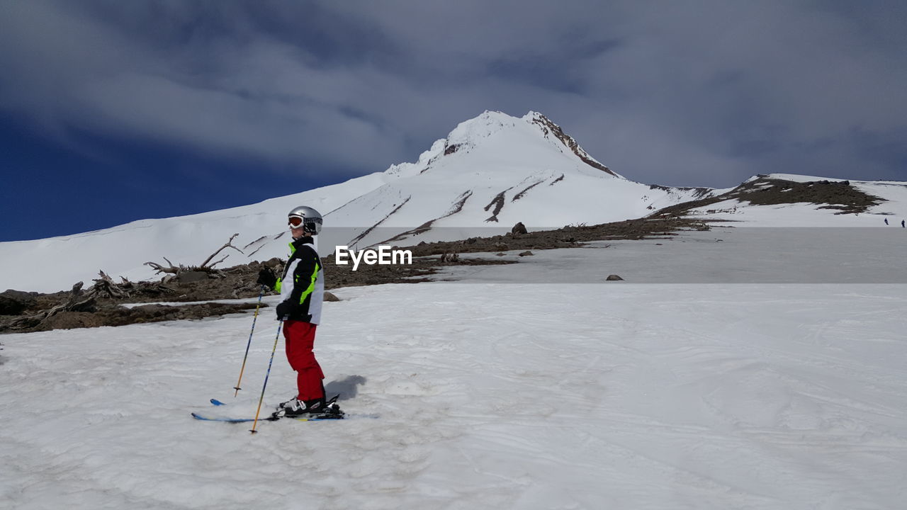 TOURISTS ON SNOW COVERED MOUNTAINS