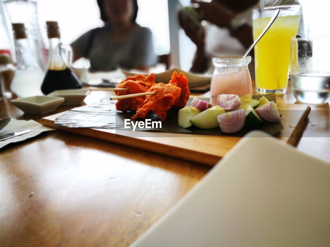 Food on cutting board over table